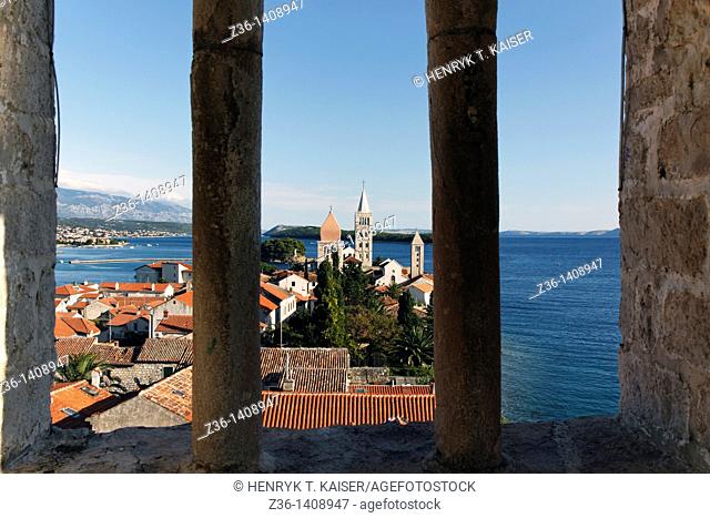 View of Rab Town through arch of Roman bell tower in Rab, Croatia, Europe