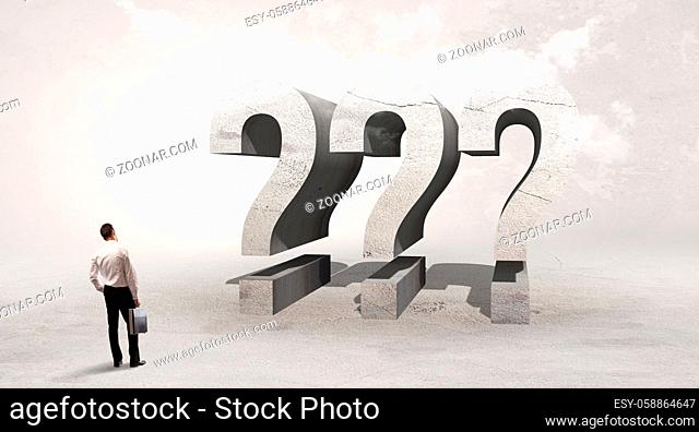 Rear view of a businessman standing in front of ??? abbreviation, attention making concept