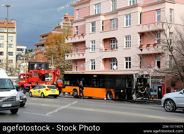 Sofia, Bulgaria - November 8, 2016: Burnt public traffic bus is seen on the street after caught in fire during travel and extinguished by firefighters