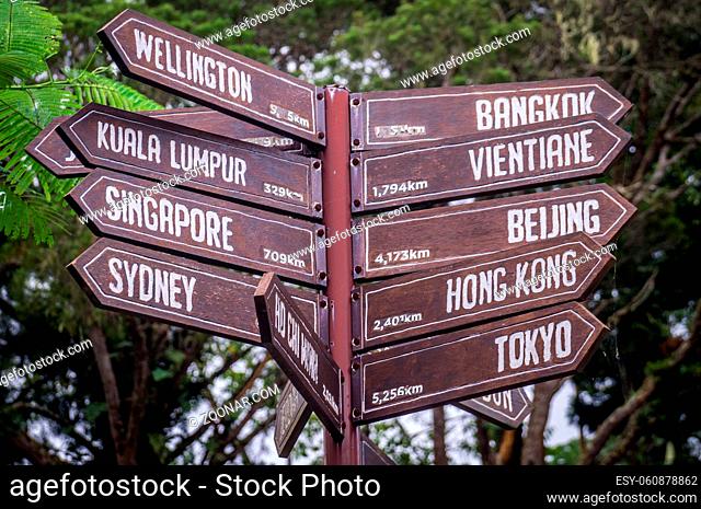 Sign posts in Penang, Malaysia pointing towards cities in Asia, Australia and New Zealand