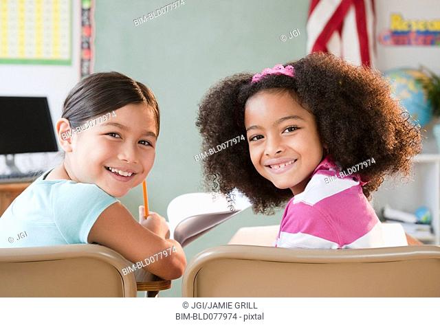 School girls smiling in classroom
