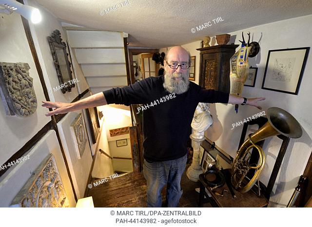 Klaus Trippstein, resident and owner of the 'Narrow House', poses in his house in Eisenach, Germany, 07 November 2013. With a width of 2