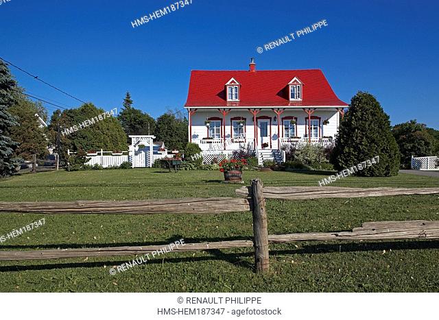 Canada, Quebec Province, Ile d' Orleans, Typical house with a red roof