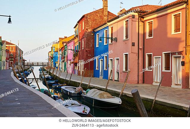 Sunrise along a Burano canal lined with brightly painted houses, Venetian Lagoon, Veneto, Italy, Europe