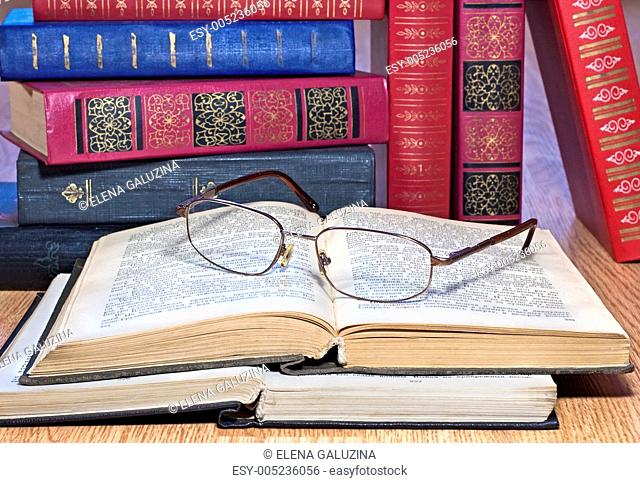 Vintage books with glasses
