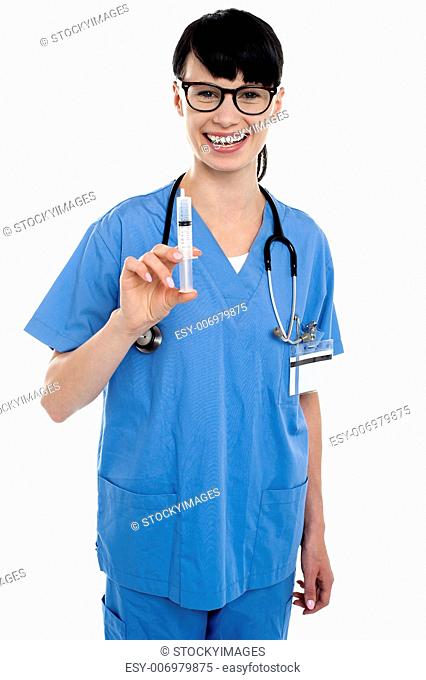 Nurse holding up syringe. Ready to be inserted into patient