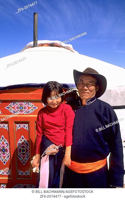 Nomadic Villager with Granddaughter next to Ger rural Mongolia