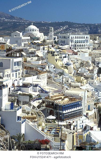 Santorini, Greek Islands, Cyclades, Fira, Greece, Europe, Whitewashed buildings in the village of Fira on the steep hillside of Santorini Island on the Aegean...