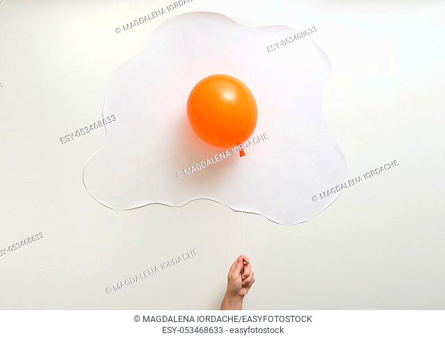 Abstract Orange Balloon With White Paper In Shape Of An Fried Egg