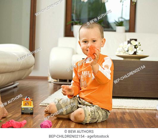Boy playing on the floor