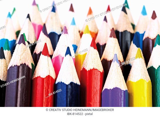 Sharpened pencil crayons, colouring pencils in rows
