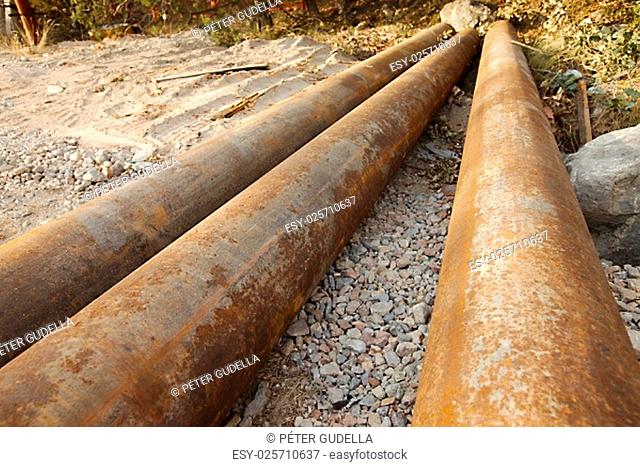 Rusty tubes in the ground
