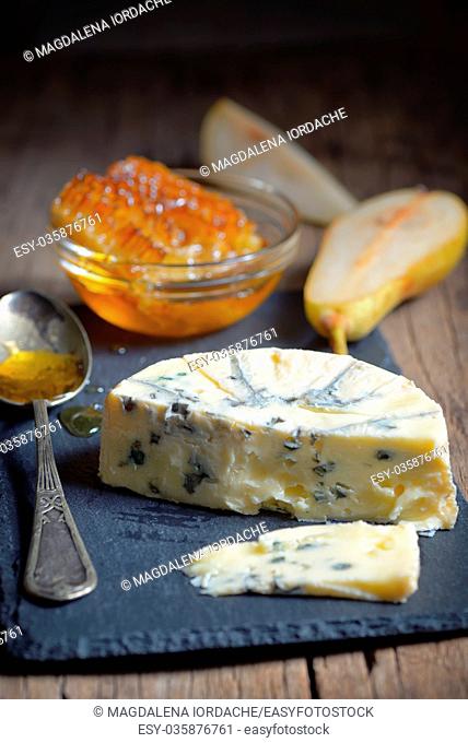 Blue Cheese and honey on ardesia plate
