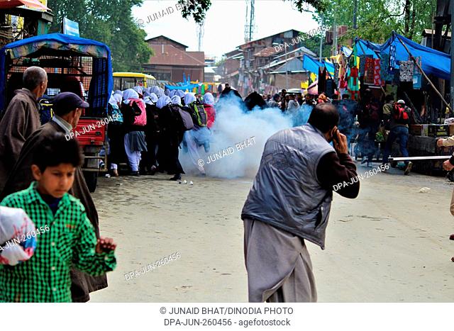tear gas shell explodes near Kashmiri students protesting, Kashmir, India, Asia