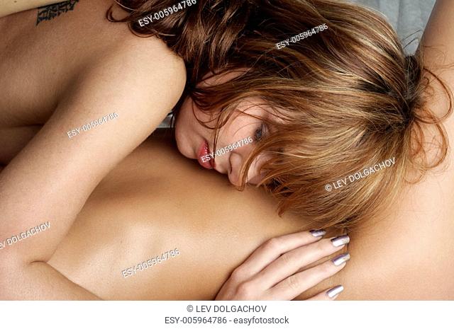 two naked girls cuddling