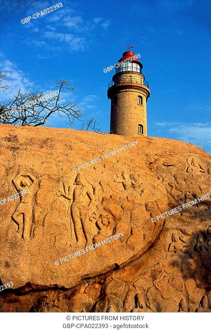 India: The lighthouse (built 1894) above a rock-cut relief from the 7th century CE, Mahabalipuram, Tamil Nadu State