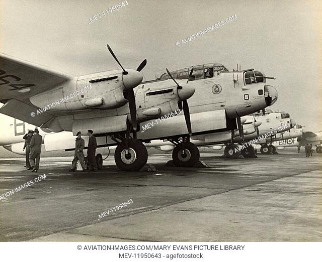 A Row of 120 Squadron Royal Air Force RAF Coastal Command Avro 683 Lancaster ASR-3S Parked with Bomb-Doors Open and Ground Crew