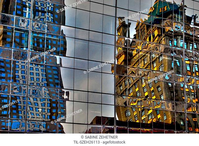 Reflections of buildings in Midtown Manhattan in windows