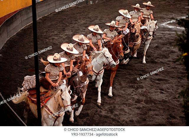 Escaramuzas ride their horses before competing in an Escaramuza competition in the Lienzo Charros del Pedregal, Mexico City, Sunday, March16, 2013