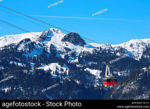 Chaserrugg cable car and snow covered mountains