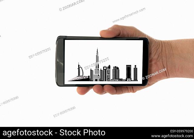 female hand with mobile phone isolated on white with dubai skyline