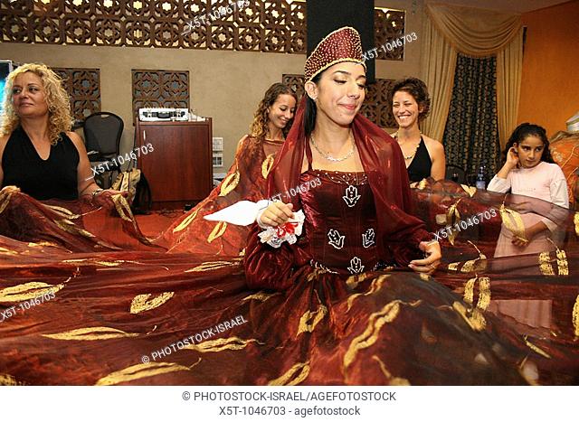 The bride in traditional Moroccan dress at the Henna celebration, Israel The Hina, also Henna, ceremony proceeds the wedding day  In this festive ceremony