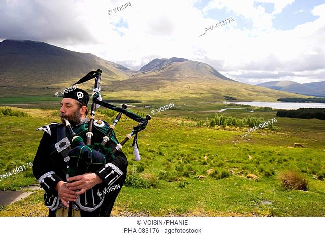 Bagpipe player, Loch Tulla, Scotland