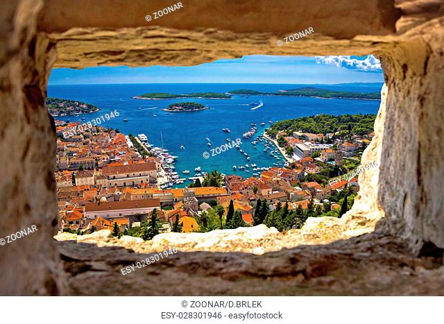 Hvar bay aerial view through stone window