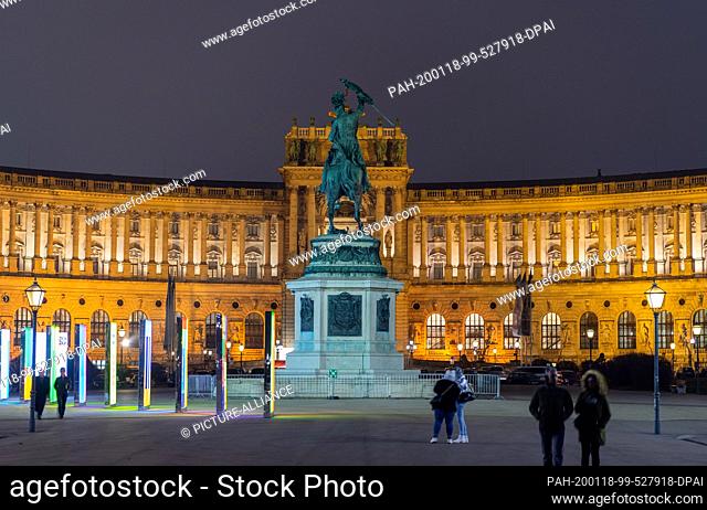 17 January 2020, Austria, Wien: View of the New Hofburg on Heldenplatz in the evening with the equestrian statue of Archduke Karl