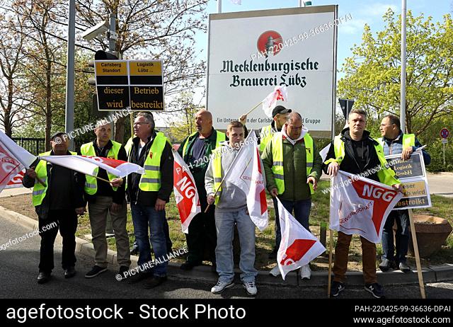 25 April 2022, Mecklenburg-Western Pomerania, Lübz: Truck drivers gather in front of the brewery to take part in the 24-hour warning strike