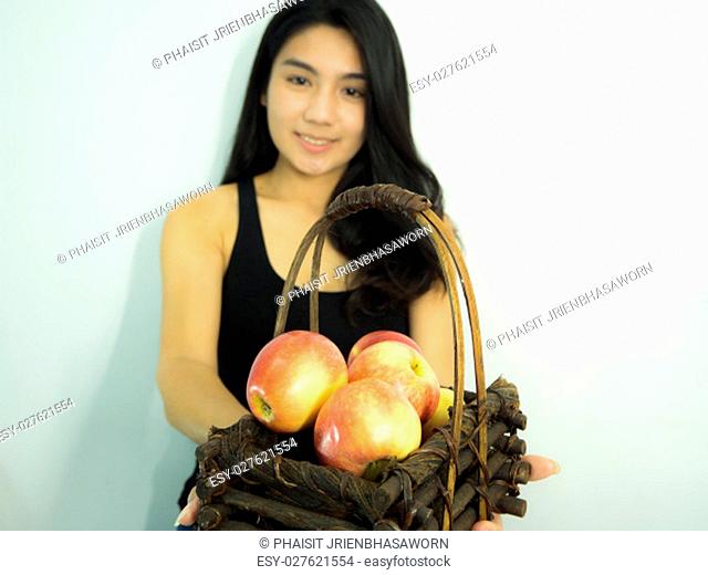 Asian woman smilling red apple on white background