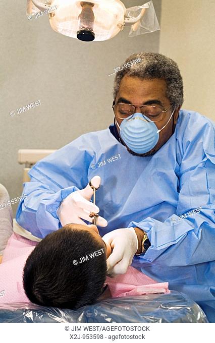 Detroit, Michigan - Dentists give free dental services to low-income children as part of the American Dental Association's 'Give Kids a Smile' campaign  Dr...
