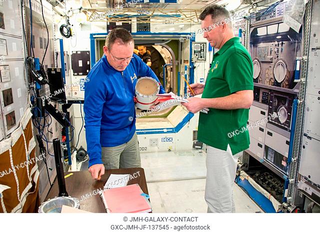 NASA astronaut Barry Wilmore (left), Expedition 41 flight engineer and Expedition 42 commander; and Russian cosmonaut Alexander Samokutyaev