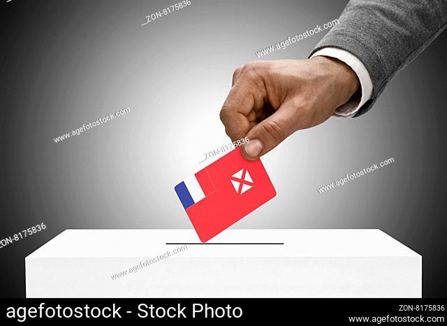 Black male holding flag. Voting concept - Wallis and Futuna