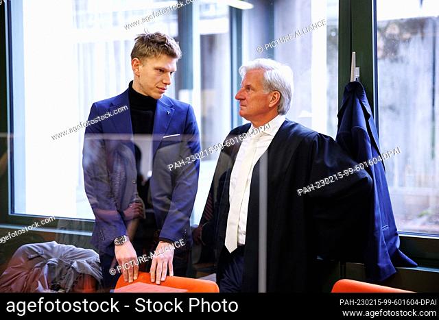 15 February 2023, Bavaria, Munich: Raphael Apostoli (l), older brother of the accident victim, stands in the courtroom next to his lawyer Klaus Höchstetter