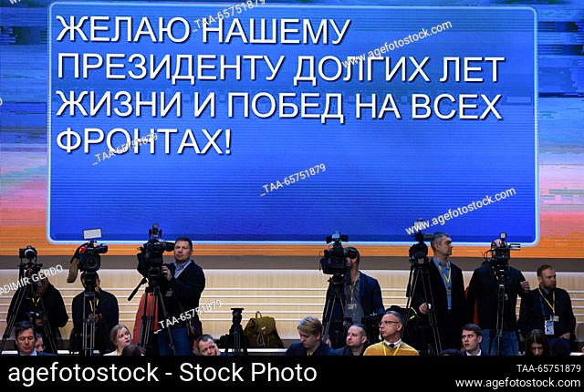 RUSSIA, MOSCOW - DECEMBER 14, 2023: Video screens show messages sent by wellwishers during an annual national live televised question-and-answer session and...