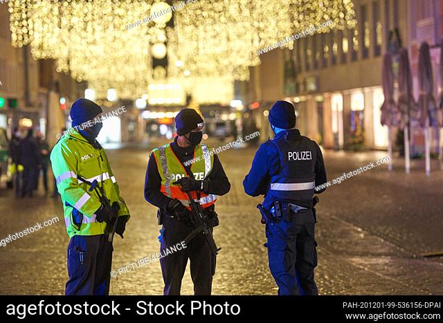 01 December 2020, Rhineland-Palatinate, Trier: Police officers are securing downtown Trier. In the afternoon, a man had driven a car through the pedestrian zone...