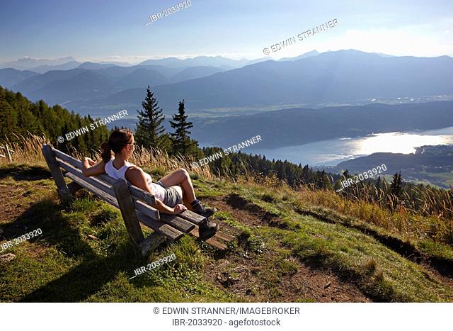 Female hiker overlooking Lake Millstatt, Carinthia, Austria
