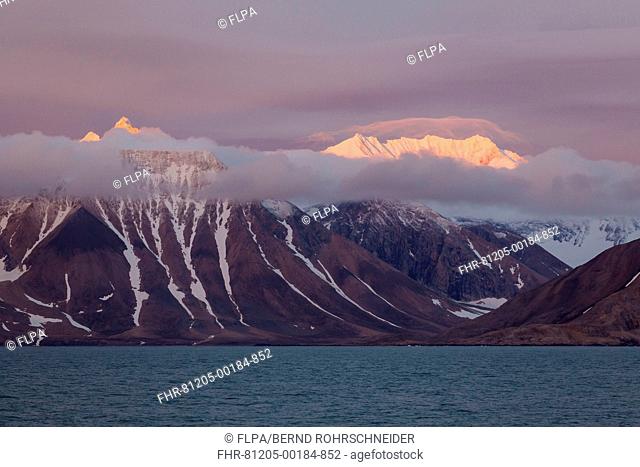 View of fjord coastline and mountains at sunset, Hornsund, Spitsbergen, Svalbard, August