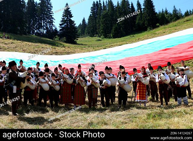 Rozhen, Bulgaria - July 19, 2019: Rhodope bagpipers playing tunes on a famous Rozhen folklore festival in Bulgaria