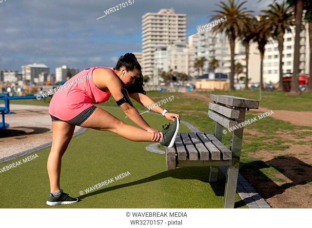Female jogger exercising in the park