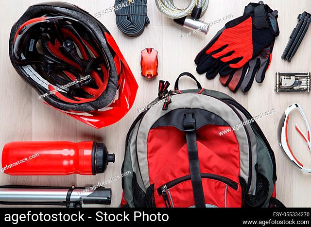 Image on top of biker accessories on empty wooden background