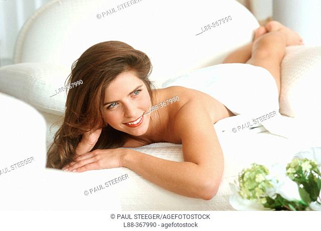 Woman lying on sofa