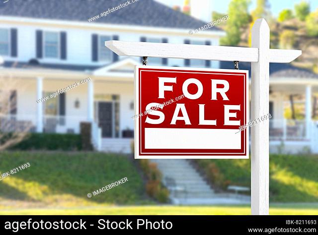 Left facing for sale real estate sign in front of house