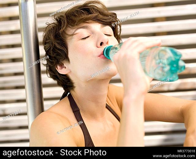 Woman drinking, portrait