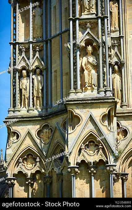 Statues on the facade of the the medieval Wells Cathedral built in the Early English Gothic style in 1175, Wells Somerset, England