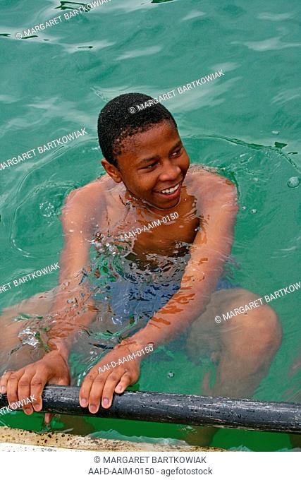 School boy in swimming pool, St Mark's School, Mbabane, Hhohho, Kingdom of Swaziland
