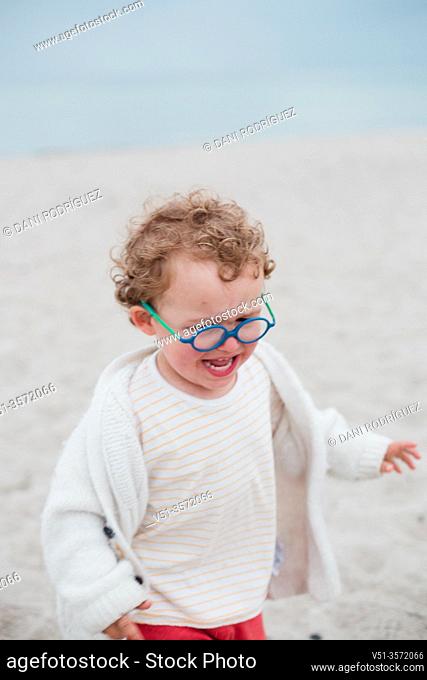2 years old boy crying at the beach