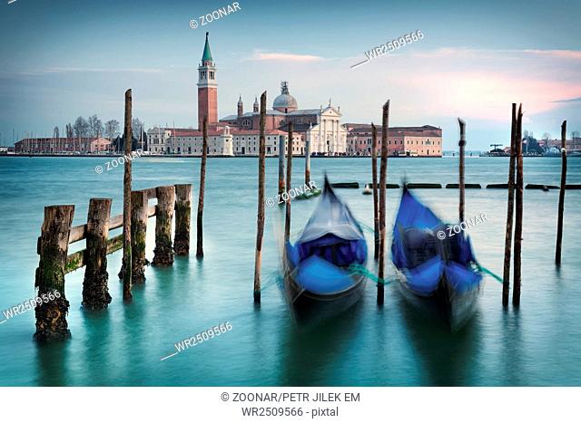 Venice with gondolas on Grand Canal against San Giorgio Maggiore church