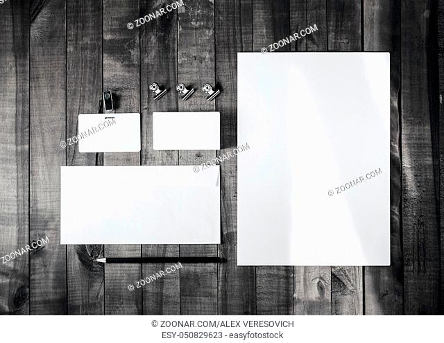 Blank corporate stationery on wood background. Branding mockup for placing your design. Top view